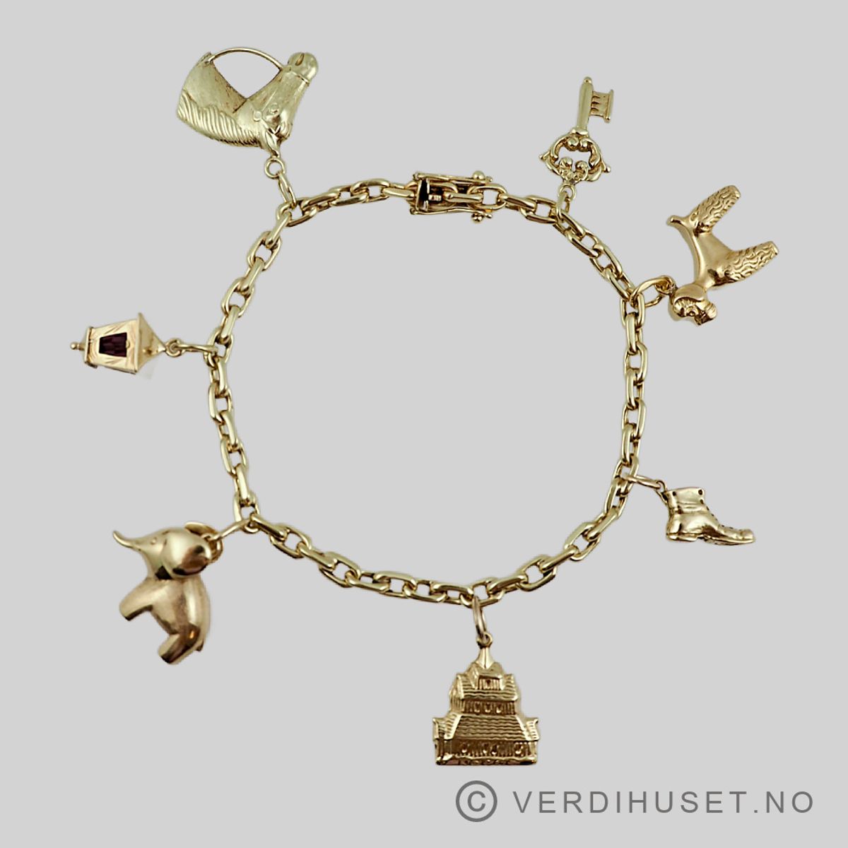 Armbånd i 14 K gull med charms